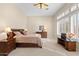 Bright primary bedroom with natural light and neutral décor at 42047 N Moss Springs Rd, Anthem, AZ 85086