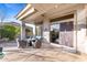 Covered patio with outdoor seating area overlooking backyard pool at 42047 N Moss Springs Rd, Anthem, AZ 85086