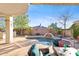 Backyard pool area featuring a water feature, desert landscaping and a patio with wicker furniture at 42047 N Moss Springs Rd, Anthem, AZ 85086