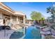 Beautiful backyard pool and patio area, perfect for outdoor entertaining and relaxation at 42047 N Moss Springs Rd, Anthem, AZ 85086