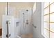 Modern shower with glass door and tile surround at 42047 N Moss Springs Rd, Anthem, AZ 85086