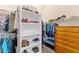 Organized walk-in closet featuring shelving and hanging storage for clothing and shoes at 42047 N Moss Springs Rd, Anthem, AZ 85086