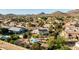 A beautiful aerial view of the home and backyard, showcasing the pool, landscaping, and neighborhood at 4803 W Buckskin Trl, Phoenix, AZ 85083