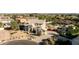 Aerial view of the property showcasing the well-maintained landscape, pool and surrounding neighborhood at 4803 W Buckskin Trl, Phoenix, AZ 85083