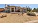 Charming two-story home showcasing desert landscaping and a tile roof, blending elegance at 4803 W Buckskin Trl, Phoenix, AZ 85083