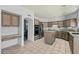 Spacious kitchen featuring stainless steel appliances, granite countertops, and a tile floor at 4803 W Buckskin Trl, Phoenix, AZ 85083