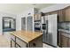 Kitchen with stainless steel appliances, tile floors, wood cabinets and granite countertops at 4803 W Buckskin Trl, Phoenix, AZ 85083