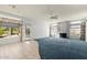 Open-concept living space with a cozy fireplace and natural light, seamlessly connects indoor and outdoor areas at 4803 W Buckskin Trl, Phoenix, AZ 85083