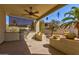 This outdoor kitchen has a built-in grill, counter space, and fan for summer entertaining at 4803 W Buckskin Trl, Phoenix, AZ 85083