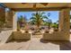 Covered patio showcasing decorative fountain, potted plants and backyard view at 4803 W Buckskin Trl, Phoenix, AZ 85083