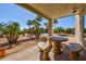 This is a covered patio area with outdoor seating perfect for enjoying the backyard view at 4803 W Buckskin Trl, Phoenix, AZ 85083