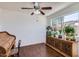 Inviting bedroom space featuring a classic ceiling fan and an ornate wooden dresser at 482 Leisure World --, Mesa, AZ 85206
