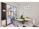Eat-in kitchen with a modern black glass dining table, offering a cozy spot for breakfast and lunch at 482 Leisure World --, Mesa, AZ 85206
