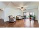 Open living room featuring hardwood floors, ceiling fan, and sliding glass doors to outdoor patio at 482 Leisure World --, Mesa, AZ 85206