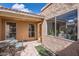 A charming outdoor patio space offers tile flooring and tranquil view through surrounding windows at 482 Leisure World --, Mesa, AZ 85206