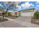 Cozy single-story home with a two-car garage and xeriscaping at 5189 N 206Th Dr, Buckeye, AZ 85396
