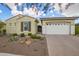 Charming single-story home featuring a two-car garage and desert landscaping at 5189 N 206Th Dr, Buckeye, AZ 85396