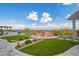 Backyard with a firepit sitting area, beautiful landscaping, and mountain views at 5189 N 206Th Dr, Buckeye, AZ 85396