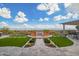 The backyard has a firepit and outdoor seating with desert landscaping and mountain views at 5189 N 206Th Dr, Buckeye, AZ 85396