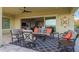 Inviting outdoor living space with comfortable seating and a stylish rug, perfect for relaxation at 5189 N 206Th Dr, Buckeye, AZ 85396