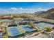 Aerial image of tennis and pickleball courts next to the pool and clubhouse at 5189 N 206Th Dr, Buckeye, AZ 85396