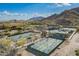 Aerial view of pickleball courts along with community pool and clubhouse facilities at 5189 N 206Th Dr, Buckeye, AZ 85396