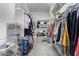 An organized walk-in closet with ample storage and custom shelving at 5189 N 206Th Dr, Buckeye, AZ 85396