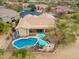 A luxurious backyard with a lagoon style pool, desert landscaping, and outdoor seating at 5210 E Calle De Baca --, Cave Creek, AZ 85331