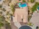 An aerial shot showcasing a desert home with desert landscaping and swimming pool at 5210 E Calle De Baca --, Cave Creek, AZ 85331
