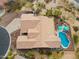 Aerial view of a home with a pool, patio area, and desert landscaping, showcasing the roof and surrounding area at 5210 E Calle De Baca --, Cave Creek, AZ 85331