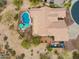 An aerial view of the property featuring a private pool, desert landscaping, and a well-maintained roof at 5210 E Calle De Baca --, Cave Creek, AZ 85331