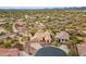 An aerial shot captures the property's desert surroundings, highlighting the home's location in a community at 5210 E Calle De Baca --, Cave Creek, AZ 85331