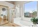 Bright bathroom features a large soaking tub next to the shower and a picturesque view at 5210 E Calle De Baca --, Cave Creek, AZ 85331