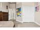 Spacious bedroom featuring wood accents, closet, vinyl floor, and neutral wall color at 5210 E Calle De Baca --, Cave Creek, AZ 85331