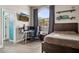Bedroom featuring natural light, desk, TV and neutral colors and wood accents at 5210 E Calle De Baca --, Cave Creek, AZ 85331