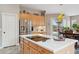 Well-appointed kitchen island featuring cooktop, stainless steel appliances, and an abundance of cabinets at 5210 E Calle De Baca --, Cave Creek, AZ 85331