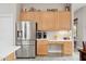 Modern kitchen with stainless steel refrigerator, breakfast nook, and ample counter space at 5210 E Calle De Baca --, Cave Creek, AZ 85331