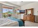 Bright main bedroom featuring backyard views and rustic wood furniture and a calming blue color scheme at 5210 E Calle De Baca --, Cave Creek, AZ 85331