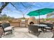 Outdoor kitchen features a grill, pizza oven and dining area on the patio with plenty of seating at 5210 E Calle De Baca --, Cave Creek, AZ 85331