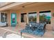 Covered patio with outdoor seating area and blue door access to the house at 5210 E Calle De Baca --, Cave Creek, AZ 85331