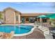 The backyard features a gorgeous pool, lush desert landscape, and dining area for entertaining at 5210 E Calle De Baca --, Cave Creek, AZ 85331