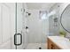 Elegant bathroom featuring a glass-enclosed shower with a mosaic tile floor and light subway tiling at 5210 E Calle De Baca --, Cave Creek, AZ 85331