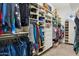 Spacious walk-in closet with custom shelving, drawers, and organized hanging storage at 5210 E Calle De Baca --, Cave Creek, AZ 85331