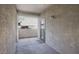 Private balcony area with textured walls and access door providing a secluded outdoor space at 5303 N 7Th St # 101, Phoenix, AZ 85014