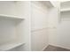 Walk-in closet provides ample storage with built-in shelving and a hanging rod at 5303 N 7Th St # 101, Phoenix, AZ 85014