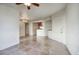 Open-concept living room with tiled floors offering seamless transition to dining and kitchen area at 5303 N 7Th St # 101, Phoenix, AZ 85014