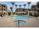 Community pool and lounge area surrounded by palm trees offering a relaxing outdoor retreat at 5303 N 7Th St # 101, Phoenix, AZ 85014