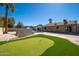 Enjoy the backyard featuring pool, putting green, and covered patio for endless outdoor entertainment at 562 W Keats Ave, Mesa, AZ 85210