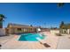 This backyard features a large in-ground pool, basketball hoop, diving board and lots of space to entertain at 562 W Keats Ave, Mesa, AZ 85210