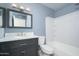 Well-lit bathroom featuring modern vanity, a stylish mirror, and a shower-tub combination at 562 W Keats Ave, Mesa, AZ 85210